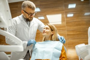 Dentist with patient at the dental office
